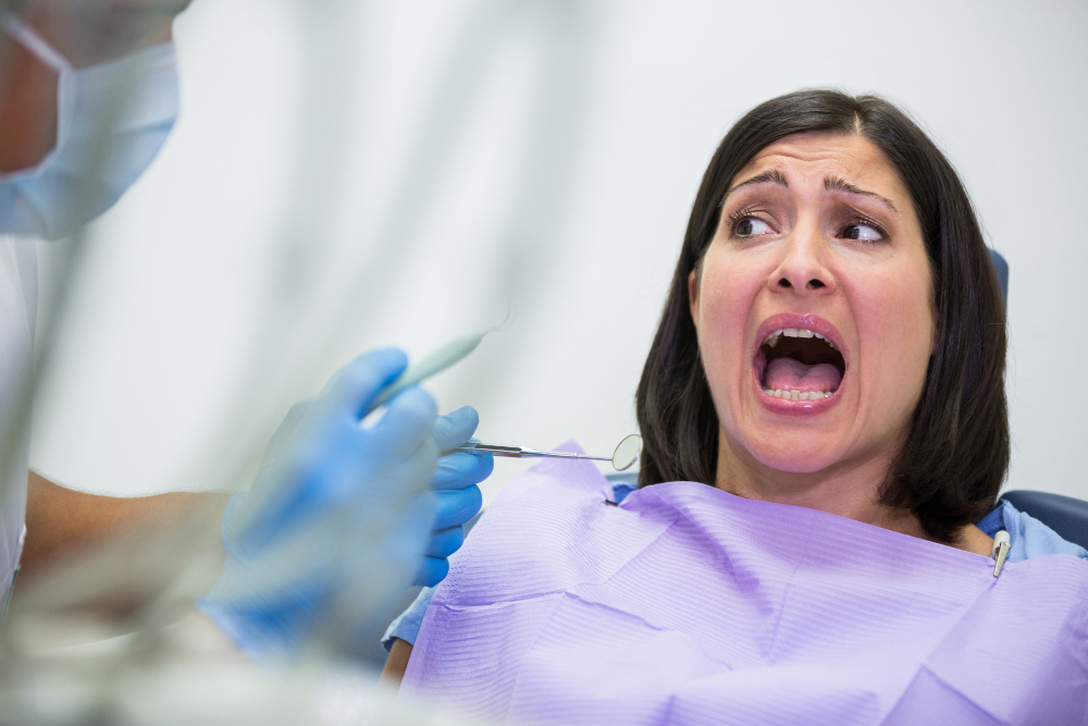 female-patient-scared-during-dental-check-up.jpg